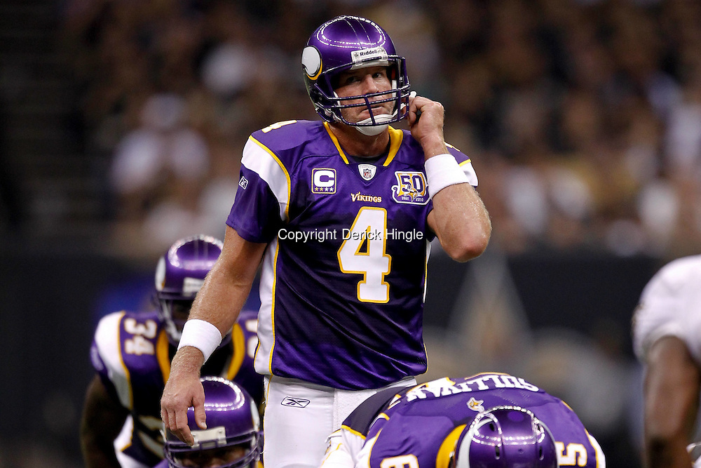 September 9, 2010; New Orleans, LA, USA; Minnesota Vikings quarterback Brett Favre (4) under center during the NFL Kickoff season opener at the Louisiana Superdome. The New Orleans Saints defeated the Minnesota Vikings 14-9. Mandatory Credit: Derick E. Hingle