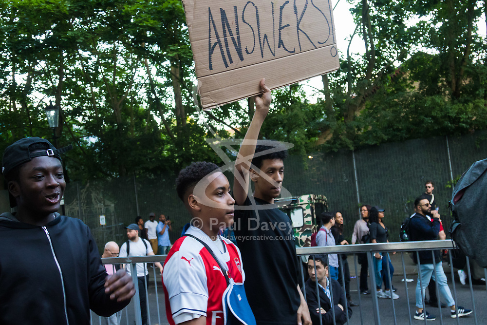 London, June 16th 2017. Local residents and supporters take to the streets around the scene of the Grenfell Tower fire disaster ahead of a vigil scheduled for 10 PM. Members of the community are demanding justice and for the authorities to better inform them as to casualties and alternative accommodation following the tragedy. In several areas of London there have been protests.