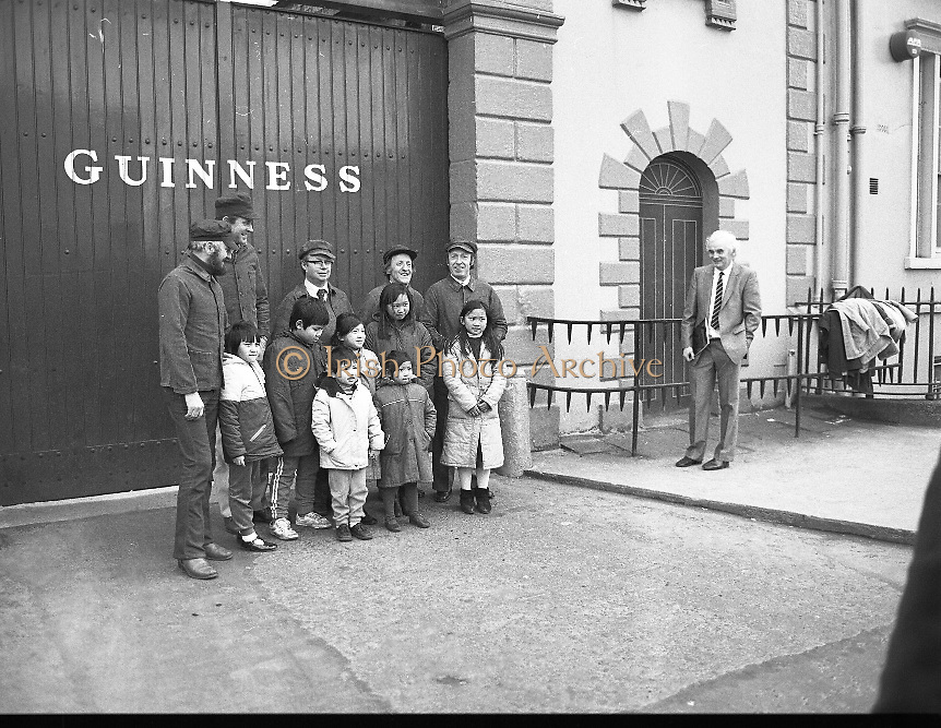 Chieftains at Guinness Brewery, Dublin meet with Chinese children on tour. ..1983-02-21.21st February 1983.21/02/1983.02-21-83 ..Pictured at Guinness Brewery, St James's Gate, Dublin..Chieftains stand outside the Guiinness Brewery