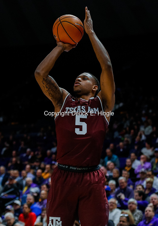 Jan 23, 2018; Baton Rouge, LA, USA; Texas A&M Aggies guard Savion Flagg (5) shoots against the LSU Tigers during the first half at the Pete Maravich Assembly Center. Mandatory Credit: Derick E. Hingle-USA TODAY Sports