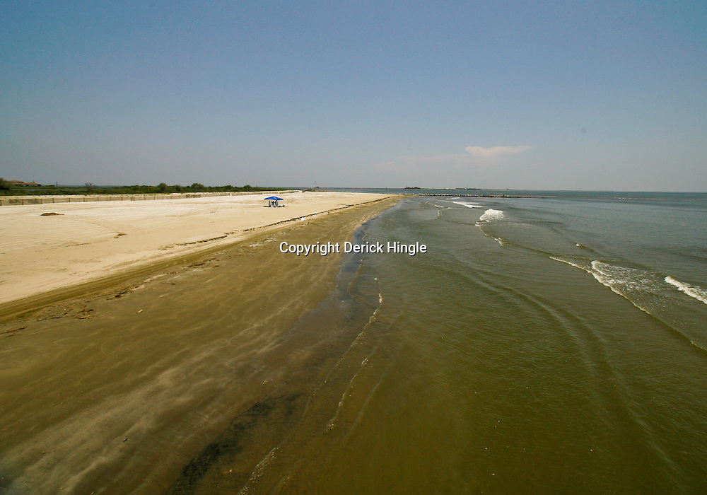 The tide washes up on the beach at the Grand Isle State Park in Grand Isle, Louisiana, U.S., on Tuesday, May 25, 2010. The BP Plc Deepwater Horizon drilling rig that exploded and collapsed into the Gulf of Mexico continues to release thousands of barrels of oil into the gulf as cleanup and containment efforts continue all along the gulf coast from Louisiana to Florida. Natural wildlife habitats along with marine life are threatened by oil that is now reaching coastal areas throughout Louisiana. Photographer: Derick E. Hingle
