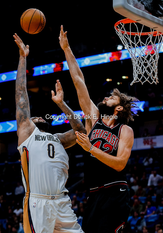 Jan 22, 2018; New Orleans, LA, USA; New Orleans Pelicans center DeMarcus Cousins (0) shoots over Chicago Bulls center Robin Lopez (42) during double overtime at the Smoothie King Center. The Pelicans defeated the Bulls 132-128 in double overtime. Mandatory Credit: Derick E. Hingle-USA TODAY Sports