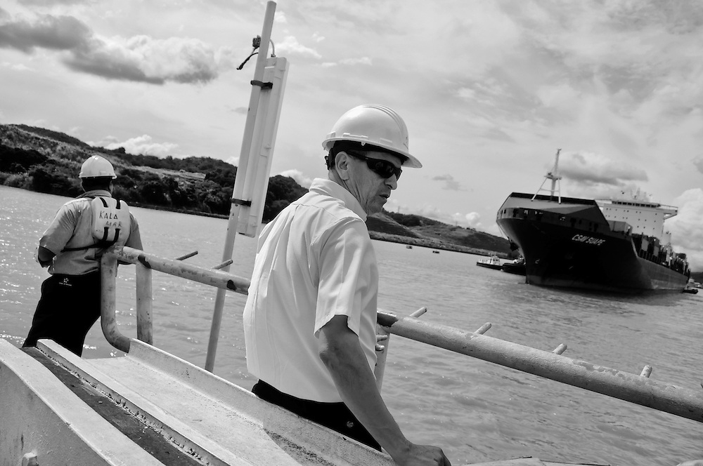 MIRAFLORES LOCKS - PANAMA CANAL<br />
Photography by Aaron Sosa<br />
Panama City, Panama 2012<br />
(Copyright © Aaron Sosa)<br />
<br />
The Panama Canal is an 77.1-kilometre (48 mi) ship canal in Panama that connects the Atlantic Ocean (via the Caribbean Sea) to the Pacific Ocean. The canal cuts across the Isthmus of Panama and is a key conduit for international maritime trade. There are locks at each end to lift ships up to Lake Gatun (26m (85ft) above sea-level) which was used to reduce the amount of work required for a sea-level connection. The current locks are 33.5m (110ft) wide although new larger ones are proposed.<br />
<br />
Work on the canal, which began in 1881, was completed in 1914, making it no longer necessary for ships to sail the lengthy Cape Horn route around the southernmost tip of South America (via the Drake Passage) or to navigate the dangerous waters of the Strait of Magellan. One of the largest and most difficult engineering projects ever undertaken, the Panama Canal shortcut made it possible for ships to travel between the Atlantic and Pacific Oceans in half the time previously required. The shorter, faster, safer route to the U.S. West Coast and to nations in and along the Pacific Ocean allowed those places to become more integrated with the world economy.