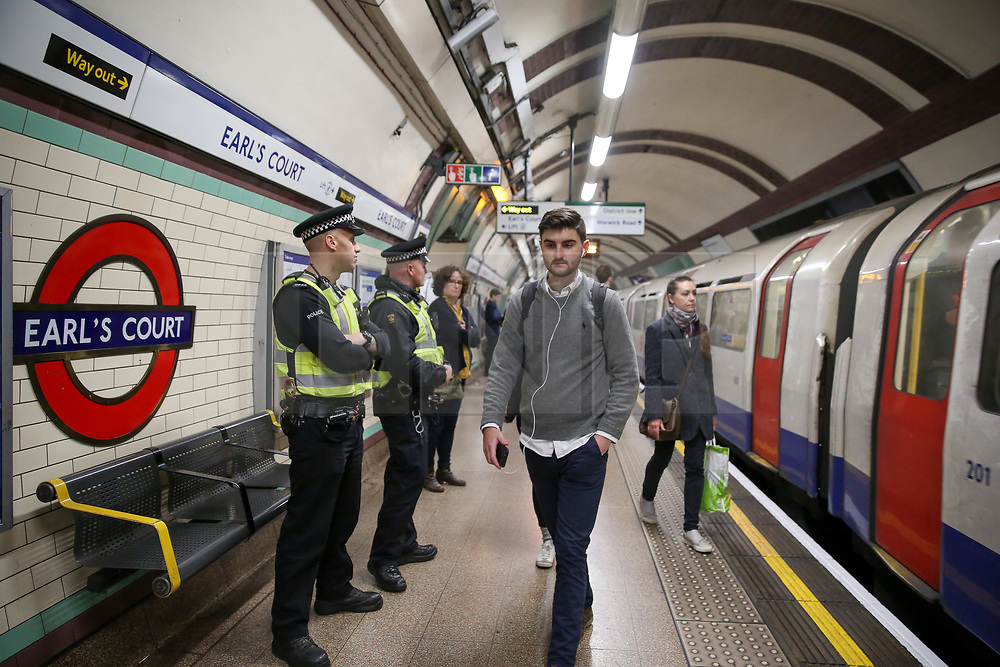 © Licensed to London News Pictures. 17/04/2019. London, UK. British Transport Police Officers at Earl's Court station platform as the Extinction Rebellion group plans to cause disruption on London Underground demanding decisive action from the UK Government on the environmental crisis. Photo credit: Dinendra Haria/LNP