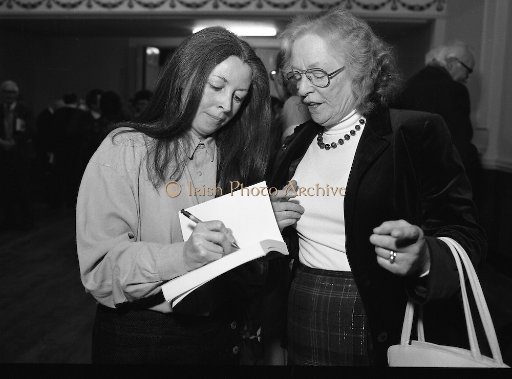 "These Obstreperous Lassies" Book Launch. (R93)..1988..15.12.1988..12.15.1988..15th December 1988..A book which chronicles an important aspect of Irish social history was launched in Larkin Hall. "These Obstreperous Lassies" written and researched by Mary Jones, details the seventy three years of the Irish Women Workers Union and of the women who were involved in the union..With Countess Markievicz as its first president, The Union began the fight for equal pay and fair treatment under the leadership of women like helen Chenevix, Louise Bennett and Helena Molloy. They fought for the rights of vulnerable workers such as Laundresses,print workers,box makers,nurses and dressmakers..The Author, Mary Jones, is a full time researcher specialising in Women and Work...Picture shows the Author Mary Jones signing a copy of her book at its launch in Larkin Hall, Parnell Square.