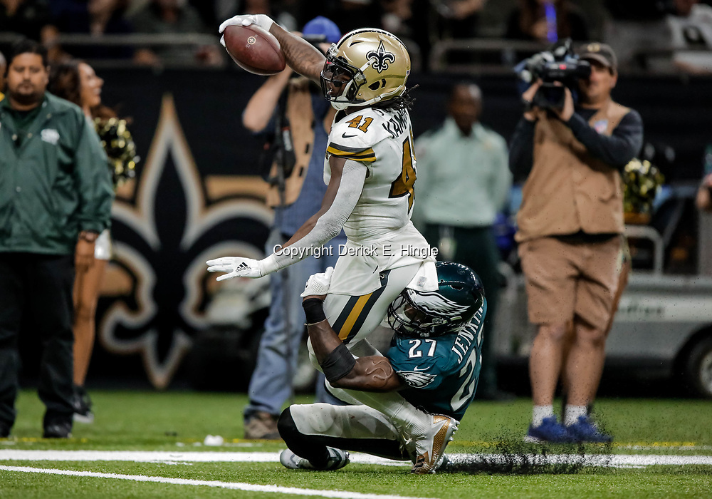 Nov 18, 2018; New Orleans, LA, USA; New Orleans Saints running back Alvin Kamara (41) scores past Philadelphia Eagles safety Malcolm Jenkins (27) during the second half at the Mercedes-Benz Superdome. Mandatory Credit: Derick E. Hingle-USA TODAY Sports