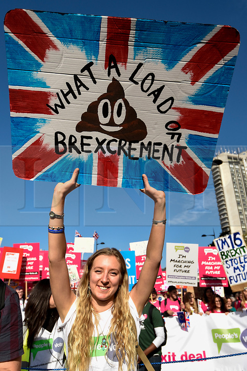 © Licensed to London News Pictures. 20/10/2018. LONDON, UK. A woman carries a placard. Thousands of people take part in a demonstration, organised by the People's Vote campaign, beginning with a march from Park Lane to a rally in Parliament Square. The People's Vote seeks a referendum on the outcome of the final Brexit negotiations ahead of 29 March 2019, the date that the UK is due to leave the EU. Photo credit: Stephen Chung/LNP