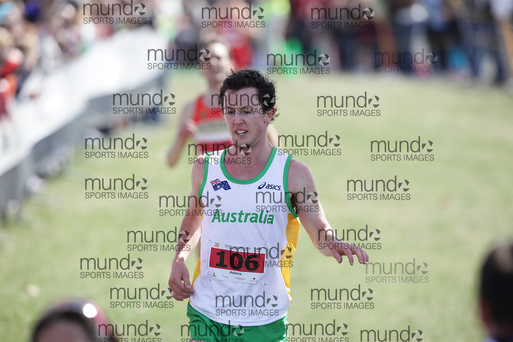 (Kingston, Canada---11 April 2010) Liam Adams (#106) of Australia (AUS) runs in the \men's 10km race\ at the 17th World University Cross Country Championships (FISU) held on the Fort Henry Hill course in Kingston, Ontario, Canada. This photograph is Copyright Geoff Robins / Mundo Sport Images, 2010. For information, go to www.mundosportimages.com or contact info@mundosportimages.com.
