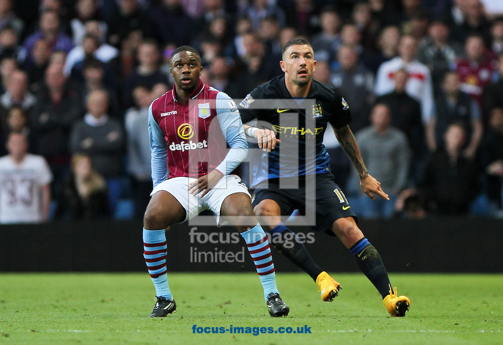 Charles N'Zogbia (left) of Aston Villa and Aleksandar Kolarov (right) of Manchester City during the Barclays Premier League match at Villa Park, Birmingham<br />
Picture by Tom Smith/Focus Images Ltd 07545141164<br />
04/10/2014