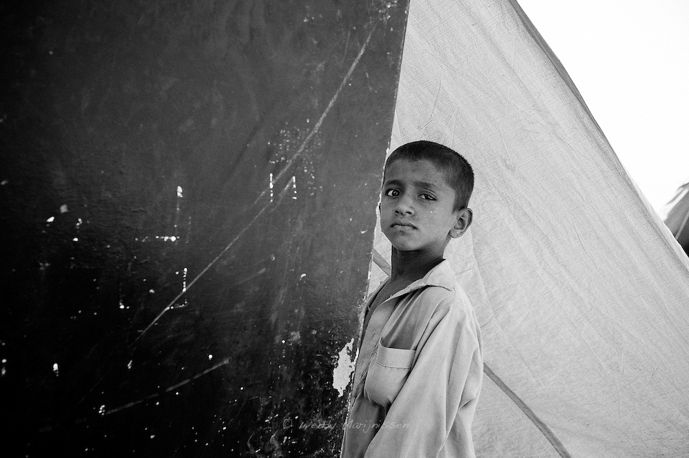 A young boy with an eye infection in a camp in Khaipur. Most children suffer from skin and eye infections, have diarrhea and show signs of dehydration. Hygienic conditions are bad and most people have no idea how to maintain good personal hygiene. Khaipur, Pakistan, 2010