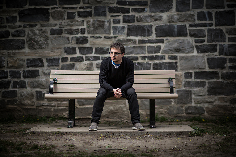 Robb Barnes, front man of Ottawa's The Pale Light, and Executive Director of Ecology Ottawa, sits on a park bench in the Hintonburg neighbourhood of Ottawa in May 2017 for some portrait photography.