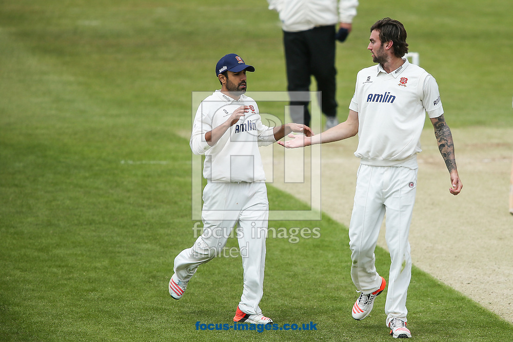 Ravi Bopara of Essex (left) congratulates Reece Topley of Essex (right) on taking the wicket of Rob Keogh of Northamptonshire (not shown) during the LV County Championship Div Two match at the County Ground, Northampton<br />
Picture by Andy Kearns/Focus Images Ltd 0781 864 4264<br />
08/06/2015