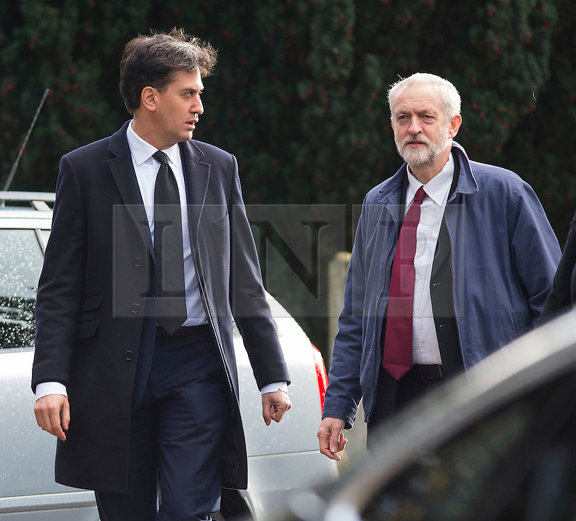 © Licensed to London News Pictures. 13/11/2015. London, UK. Former Labour party leader ED MILIBAND and current Labour party leader JEREMY CORBYN arrive for The funeral of former Labour MP Michael Meacher at St Mary's Church in Wimbledon, south west London. Michael Meacher, who was a Labour MP in Oldham for over 40 years, served as Minister of State for the Environment in the Tony Blair government. Photo credit: Ben Cawthra/LNP