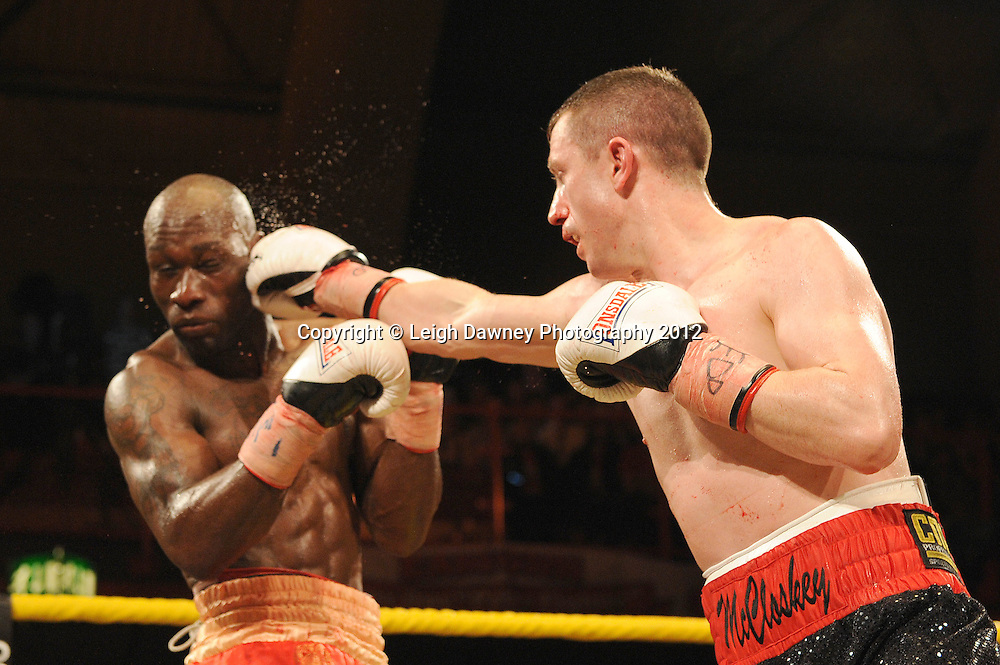 DeMarcus Corley (red shorts) defeats Paul McCloskey after the referee Ian John-Lewis stops the fight in the tenth round to claim the Light Welterweight contest at Kings Hall, Belfast, Northern Ireland on Saturday 5th May 2012. Promoted by Prizefighter/Matchroom Sport. © Leigh Dawney Photography 2012.