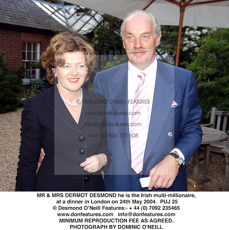 MR & MRS DERMOT DESMOND he is the Irish multi-millionaire, at a dinner in London on 24th May 2004.PUJ 25