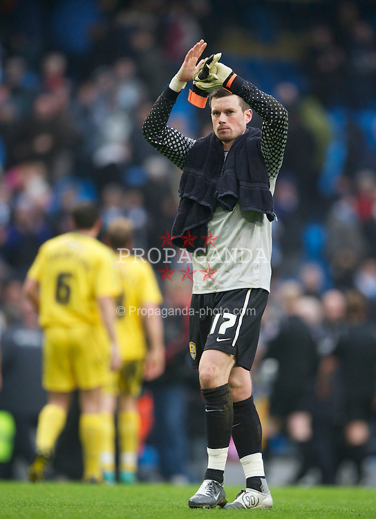 MANCHESTER, ENGLAND - Sunday, February 20, 2011: Notts County's goalkeeper Stuart Nelson applauds the travelling supporters after his side's 5-0 defeat by Manchester City during the FA Cup 4th Round Replay match at the City of Manchester Stadium. (Photo by David Rawcliffe/Propaganda)