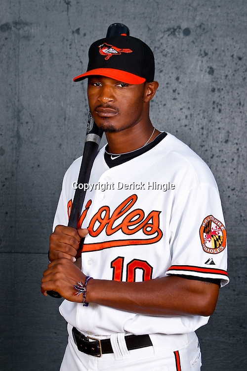 February 26, 2011; Sarasota, FL, USA; Baltimore Orioles center fielder Adam Jones (10) poses during photo day at Ed Smith Stadium. Mandatory Credit: Derick E. Hingle