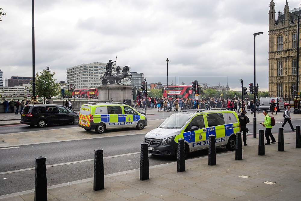 © Licensed to London News Pictures. 16/09/2017. London, UK. Two police vans containing armed police officers watch over at Westminster Bridge in London, the day after a bomb partly exploded on a tube train at Parsons Green station in London injuring members of the public. Operation temperer has been put in to place after the UK terror threat level was raised to critical. Photo credit: Ben Cawthra/LNP