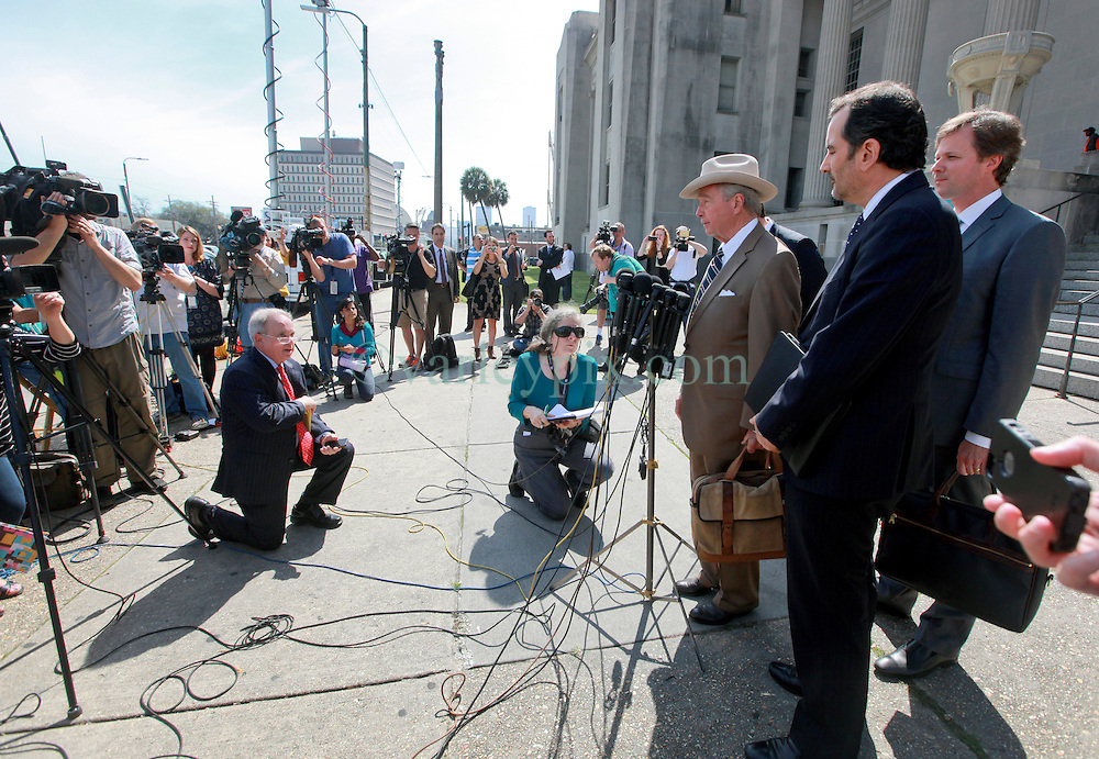 16 March 2015. New Orleans, Louisiana.<br />
Dick DeGuerin, (Brown suit with hat) Texas based lawyer for property billionaire Robert Durst gives brief statement to the assembled media outside Orleans Parish Criminal District Court following a hearing to extradite his client to Los Angeles. DeGuerin the jumped in a waiting car and was whisked away.<br />
Photo; Charlie Varley/varleypix.com