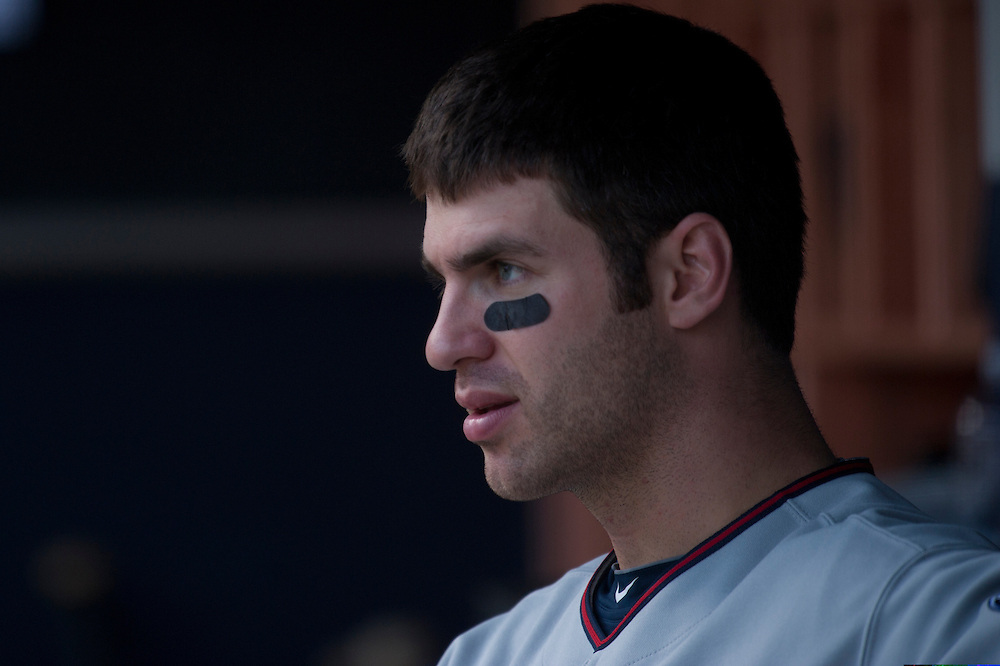 NEW YORK - MAY 16: Joe Mauer #7 of the Minnesota Twins looks on from the dugout against the New York Yankees at Yankee Stadium on May 16, 2010 in the Bronx borough of Manhattan. The Twins defeated the Yankees 6 to 3. (Photo by Rob Tringali) *** Local Caption *** Joe Mauer