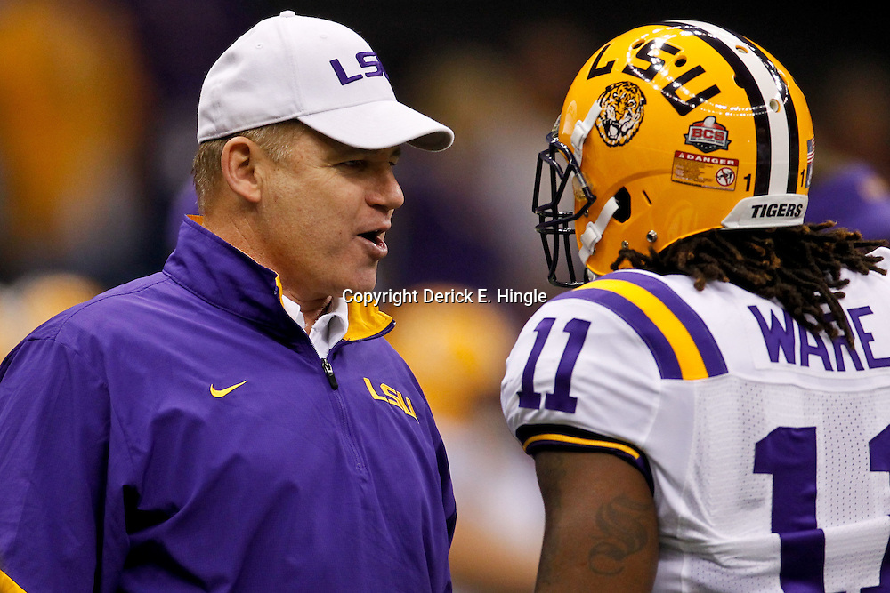 Jan 9, 2012; New Orleans, LA, USA; LSU Tigers head coach Les Miles talks with LSU Tigers running back Spencer Ware (11) before the 2012 BCS National Championship game against the Alabama Crimson Tide at the Mercedes-Benz Superdome. Mandatory Credit: Derick E. Hingle-US PRESSWIRE