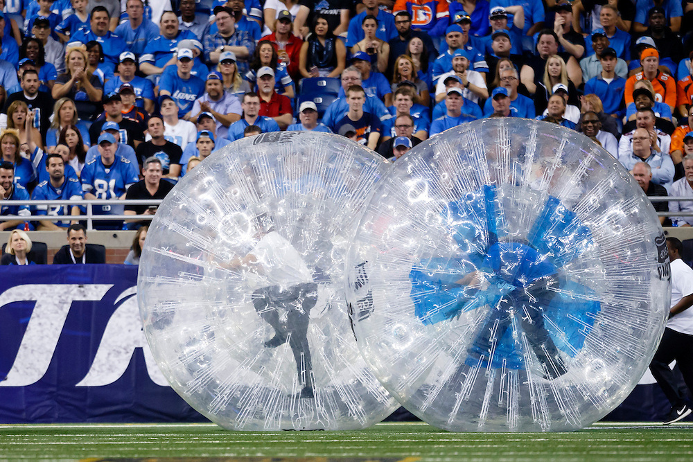 Tim Horton's human ball race during a time out of an NFL football game between the Detroit Lions and the Denver Broncos at Ford Field in Detroit, Sunday, Sept. 27, 2015. (AP Photo/Rick Osentoski)