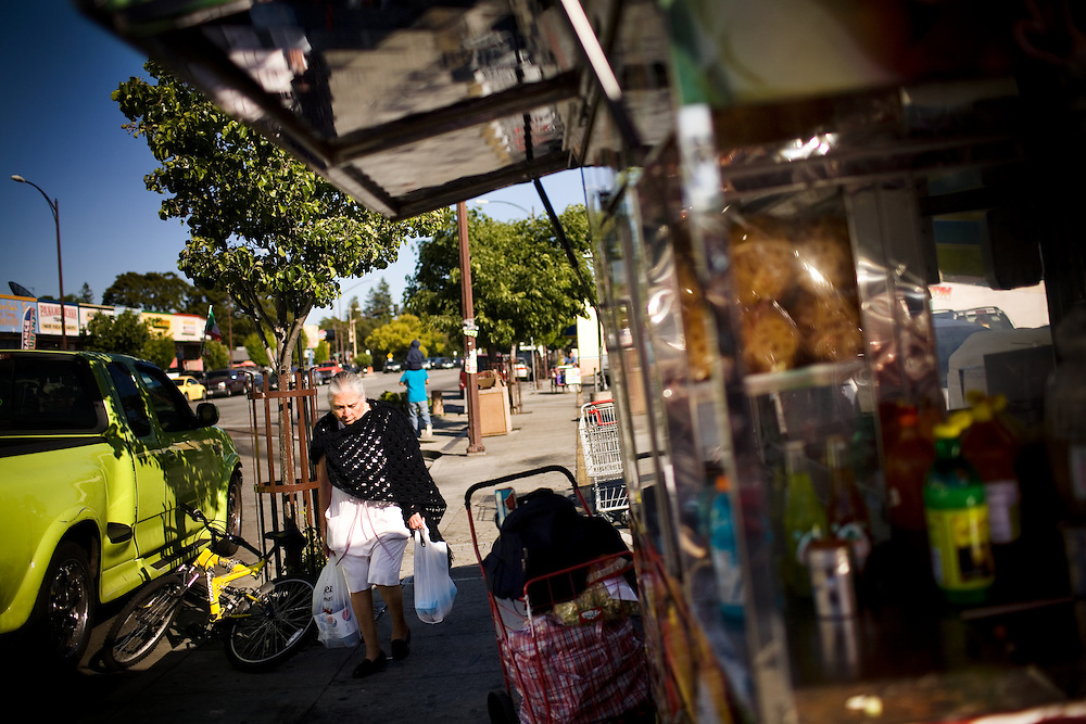 An elderly woman walks along Middlefield Rd., known as "Little Mexico," in Redwood City, Ca., on Tuesday, May 10, 2011. Along the San Francisco peninsula, just beyond the city's suburbs, a group of Asian Americans and Latinos are suing San Mateo County for what it calls a discriminatory voting system. The county has elected no Asians and just one Latino supervisor in the past 25 years even though its population is now a quarter Latino and a quarter Asian.
