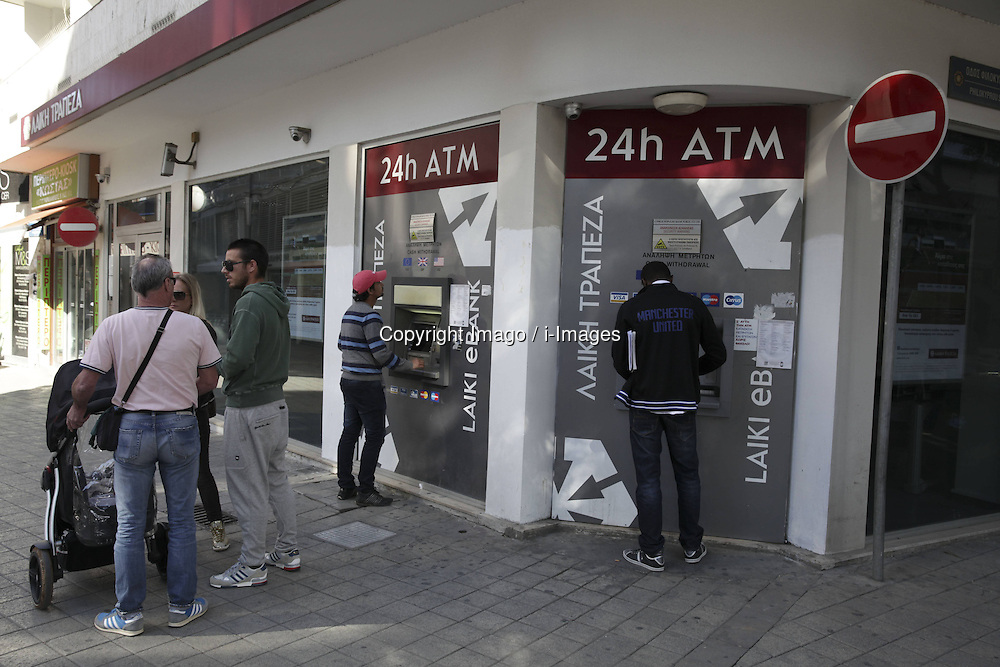 People withdraw money from Atm in Nicosia, Cyprus, March 19,2013. Photo by Imago / i-Images...UK ONLY.Contact..