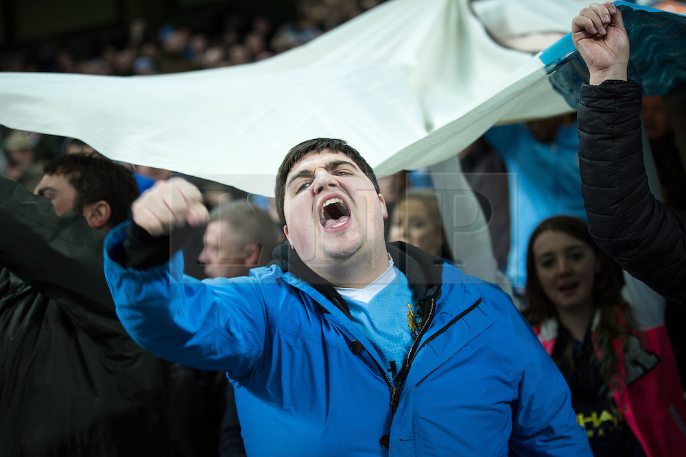 © Licensed to London News Pictures . 08/12/2015 . Manchester , UK . Manchester City fans watching Manchester City vs Borussia Monchengladbach in the UEFA Champions League at the Etihad Stadium . Photo credit : Joel Goodman/LNP