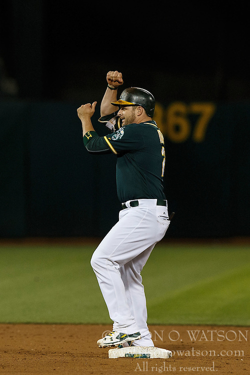 OAKLAND, CA - JULY 19: Stephen Vogt #21 of the Oakland Athletics celebrates after hitting a double against the Houston Astros during the ninth inning at the Oakland Coliseum on July 19, 2016 in Oakland, California. The Oakland Athletics defeated the Houston Astros 4-3 in 10 innings. (Photo by Jason O. Watson/Getty Images) *** Local Caption *** Stephen Vogt