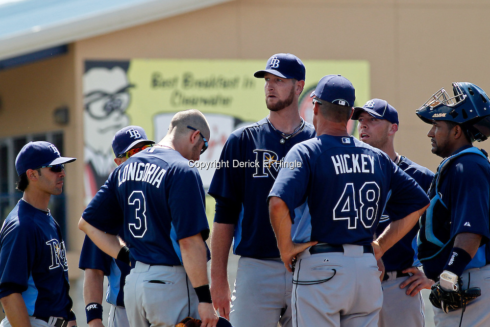 March 16, 2012; Dunedin, FL, USA; Tampa Bay Rays pitching coach Jim Hickey (48) talks with Tampa Bay Rays starting pitcher Jeff Niemann (34) and other players on the mound during the bottom of the fourth inning of a spring training game against the Toronto Blue Jays at Florida Auto Exchange Stadium. Mandatory Credit: Derick E. Hingle-US PRESSWIRE