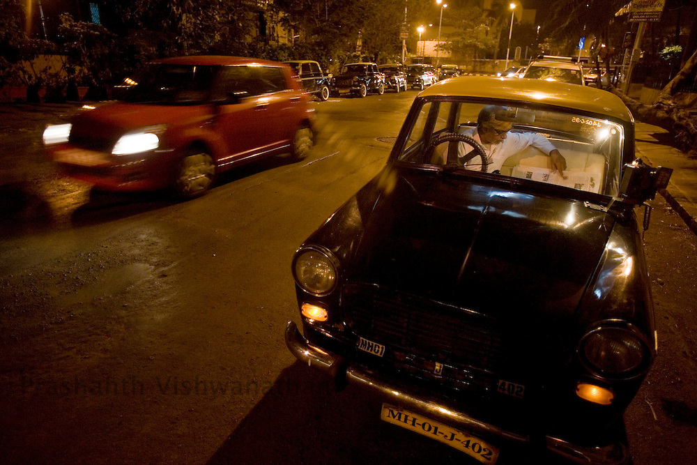 A taxi driver awaits customers at night in the Colaba area of Mumbai, India, February 8, 2008. Prashanth Vishwanathan\ATLAS PRESS