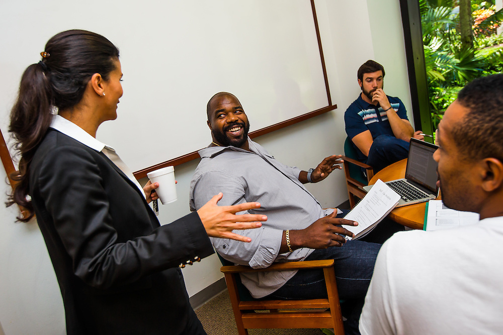 MIAMI, FL - June 24, 2015 -- Former NFL player Gerard Warren, left, and quarterback Trent Edwards participate in a Legal & Ethical Implications of Executive Decision Making class taught by Professor Patricia Abril at the University of Miami as part of their Miami Executive MBA for Artists & Athletes program on Wednesday, June 24, 2015. (PHOTO / CHIP LITHERLAND)