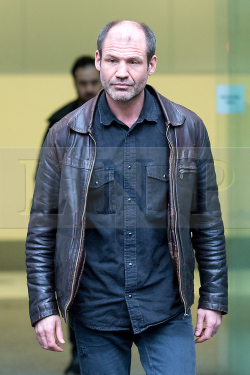 © Licensed to London News Pictures. 14/02/2018. London, UK. James (Jim) Matthews leaves Westminster Magistrates Court after appearing charged with one count of 'attending a place used for terrorist training', under section 8 of the Terrorism Act 2006. The former British Army soldier fought with Kurdish forces - the YPG - against ISIS in Syria. Photo credit : Tom Nicholson/LNP
