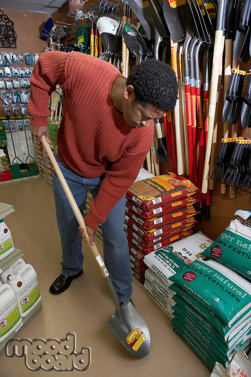 Man Trying Out a Shovel