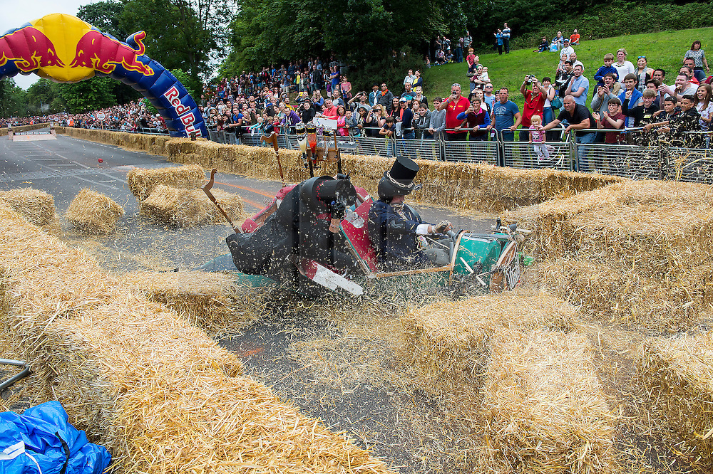 © London News Pictures. 12/07/2015. London, UK. A team competes in the 2015 Red Bull Soapbox race at Alexandra Palace in London on July 12, 2015. The annual event sees amateur drivers race homemade soapbox vehicles down a 420m hill through obstacles, relying completely upon gravity to move. Photo credit: Ben Cawthra/LNP