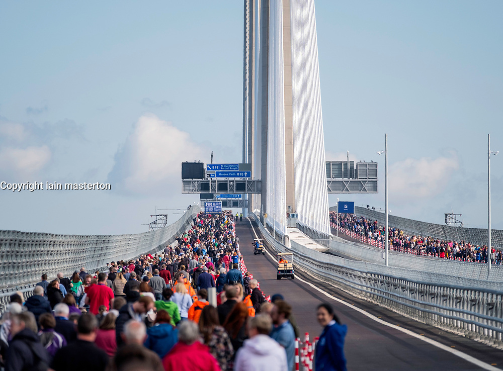 Members of the public walk across new Queensferry Crossing Bridge before it is officially opened. Scotland, United Kingdom.