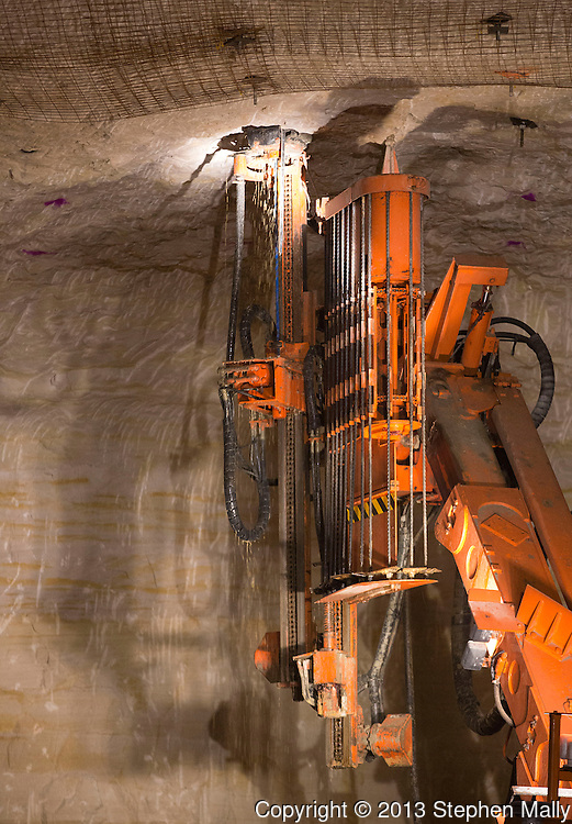 A roof bolting machine works on the ceiling of the mine at Pattison Sand Company in Garnavillo, Iowa on June 5, 2013.
